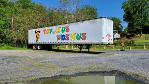 Former Toys "R" Us/Kids "R" Us trailer in the parking lot of a restaurant in Sandy Hook, Maryland.