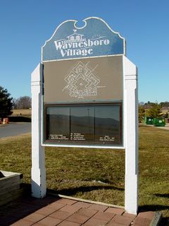 These welcome signs also illustrated the Outlet Village's identity crisis. Some signage, like the tall sign and some of the welcome signs, used the older "Waynesboro Outlet Village" logo. Others used a newer "Waynesboro Village" logo. The newer name, however, never caught on with the local community.
