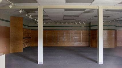 The interior of the former Bass Shoes outlet, like most of the other abandoned stores, is dark, quiet, and empty.