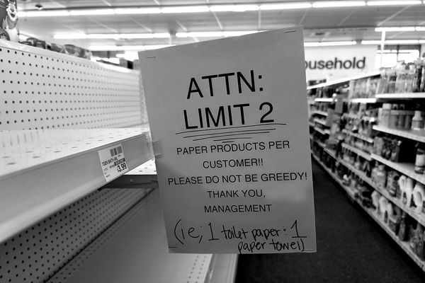 Sign at a CVS store in Williamsburg, Virginia indicating purchase limits for paper products.