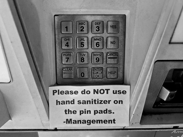 Sign at a gas station in McLean, Virginia asking that patrons not apply hand sanitizer to the PIN pads at the pumps.