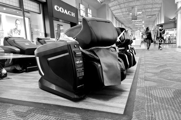 A row massage chairs, closed in an apparent effort to limit the transmission of COVID-19, at the Arundel Mills shopping mall in Hanover, Maryland.