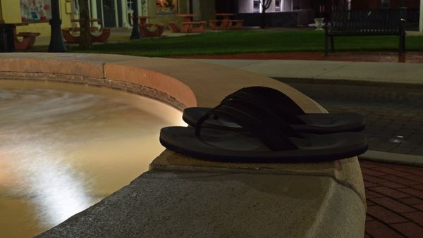 A pair of flip flops rests on the edge of a fountain in downtown Martinsburg, West Virginia.
