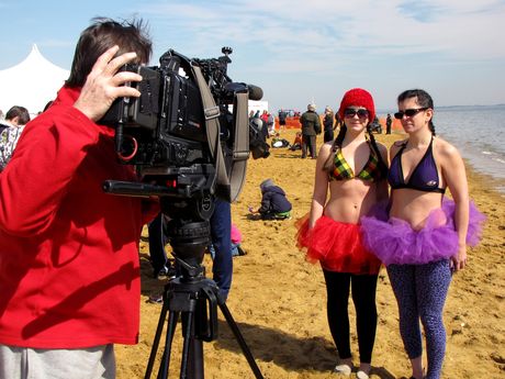 Two women are interviewed on the beach for WBAL, the NBC affiliate for the Baltimore area.