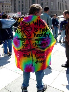 This protester, through his very own "Technicolor Dreamcoat", reminds us to think of the children...