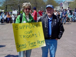 These protesters' signs reflect my own personal sentiment regarding the war. We support our troops, who are doing their best defending our honor. Now, the President and his folks on the other hand... that's another story.