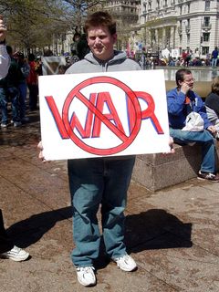 Another protester follows the KISS principle (Keep It Simple, Stupid), and projects a simple message - no war.
