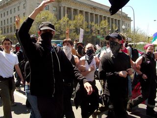 Soon after the last photo was taken, the black bloc expanded their presence out into 14th Street, essentially blocking traffic, to the chant of, "Whose streets? Our streets!"