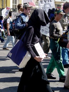 One woman simply dressed in mourning and carried a sign while marching.