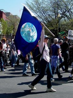 This protester carries a flag... this one simply showing the Earth on it, reminding us that we are not only citizens of our respective countries, but also citizens of the world.