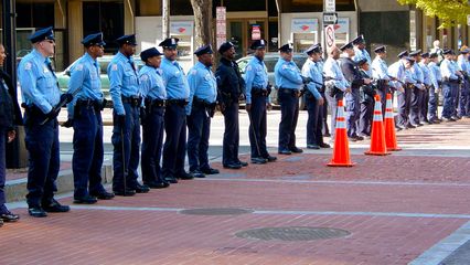 At intersections, DC Police formed lines to keep the protesters on the correct route.