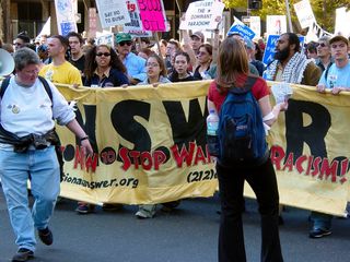 And here comes the protest group, shouting, "No blood for oil!"