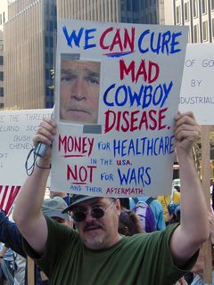 This protester is holding a sign with an idea that I was surprised didn't surface a long time ago... the whole idea of George Bush being like a cowboy.