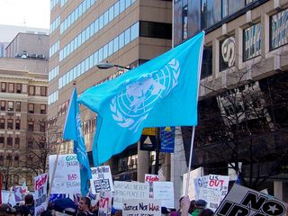 Along with the Earth flags, another flag that got flown at this protest was a United Nations flag, reminding us once again that we are also citizens of the world, as well as our respective countries.