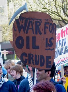 Finally, with a play on the term "Crude Oil", this protest sign tells us that war for oil is crude.