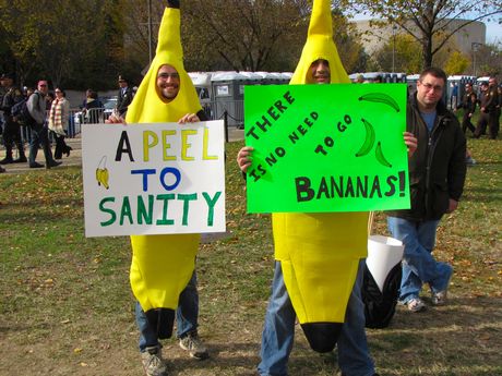 Two men in banana costumes carried signs with banana-related themes.