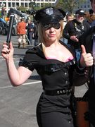 A woman dresses as a "sexy police officer".