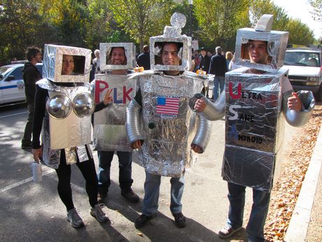 A group of four people, dressed up as robots.