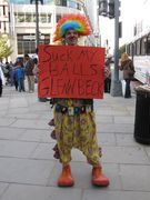 A man dressed as a clown has a somewhat uncouth message for Glenn Beck.