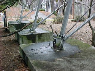 At the bottom of the star, extending 6½ feet into the ground, are concrete footpads, keeping the star firmly in place. It is unknown what the metal twine leading from the base to the ground is there for.