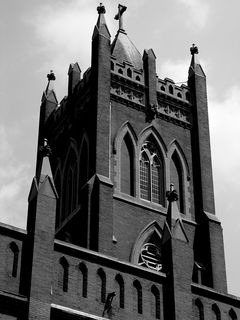 The gothic architecture of the Immaculate Conception Church stands high against the summer sky.