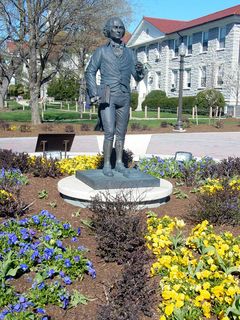 Even the area around the statue of James Madison is alive again, with purple and yellow flowers all in a row.