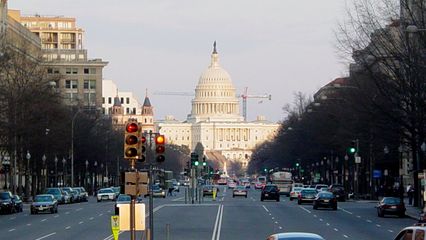 Later on that day, in the evening, the Capitol shines almost a golden color in the setting sun. These two photos were taken from Freedom Plaza, at approximately 13th Street and Pennsylvania Avenue NW.