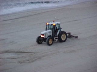 And the sand-smoothing guy continues to smooth out the sand.