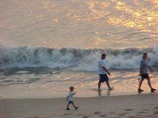 And even at this early hour, there are people waking their children up to go walking along the beach!