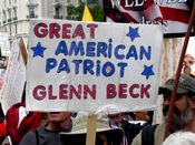 A sign describes right-wing pundit Glenn Beck as a "Great American Patriot".