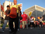 Demonstrators walk the picket lines outside the Hilton Crystal City.