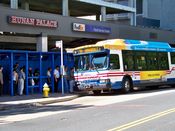 September 7, 2008: A Metrobus picks up passengers waiting in the sidewalk shed.