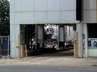 The entrance to the building's parking garage remains intact - for now.