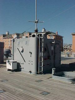 This small structure on deck was called "Crash & Smash" by the Wisconsin's crew. It's one of the ship's damage control lockers, and holds equipment designed to fight aircraft fires.