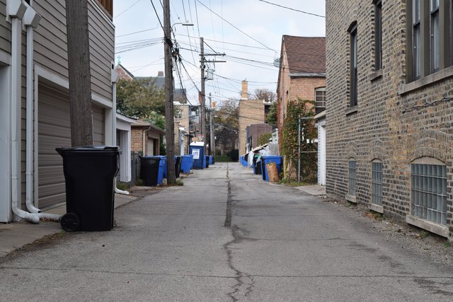 Alley running between properties on North Claremont and North Oakley Avenues, running from another alley up to West Ainslie Street.  View facing north.